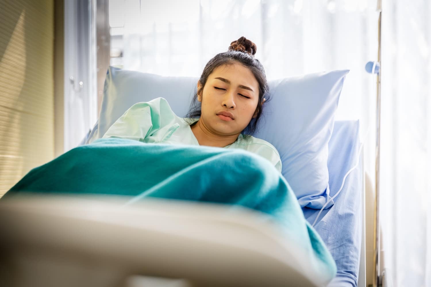 Patient with illness in hospital room